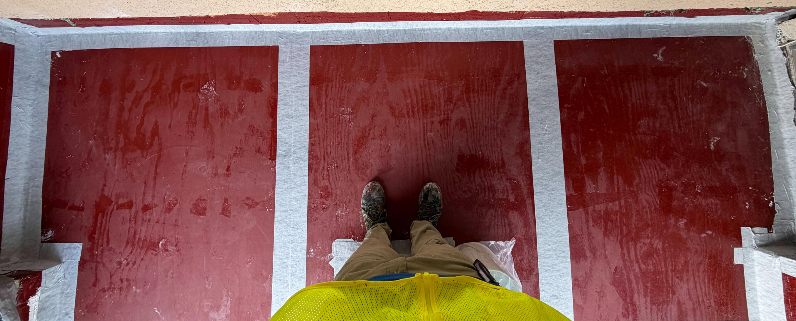 This preparatory application secures the surface with a heavy-duty epoxy primer for maximum adhesion. Structural joints are fortified using polymeric rubberized tape and elastomeric sealant to ensure a stable, monolithic base.