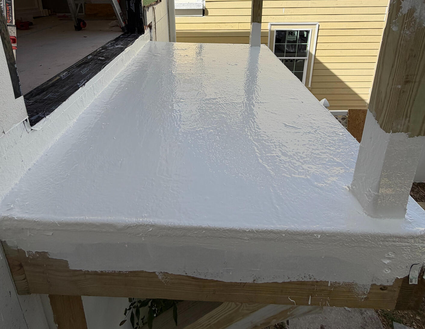 This reinforced polyurethane membrane combines glass fiber and polyamide mesh for maximum tear resistance. The system utilizes rubberized taping at critical stress points to handle settling and prolonged sun exposure.